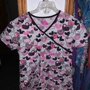 Pink, black and white scrub top